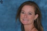Cosmetic Dentistry with a small amount of teeth showing between her lips when smiling.